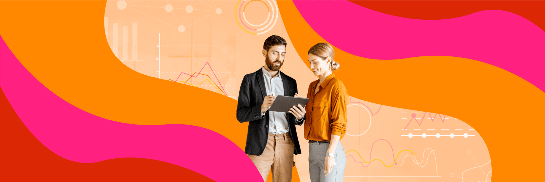 Two people in business attire look at a tablet together, standing against an abstract orange and pink background with charts and graphs.