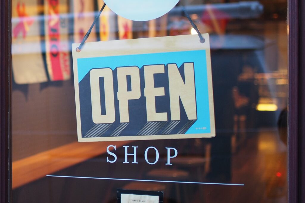 A shop window with an "OPEN" sign.