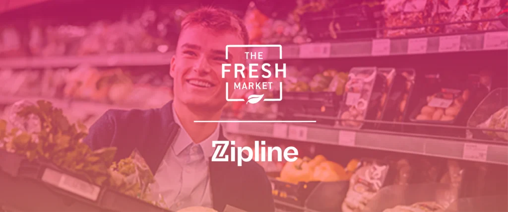 A person smiles while shopping for fresh produce in a grocery store. Text overlay reads "The Fresh Market" and "Zipline.