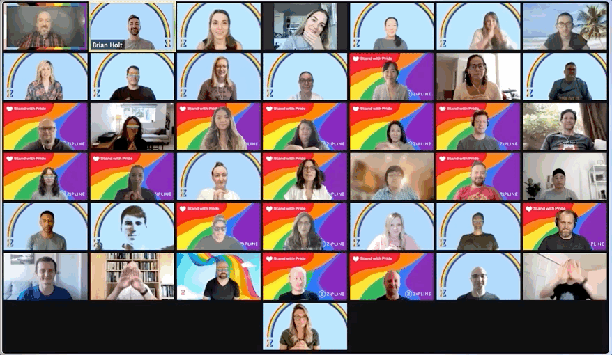 Video call with 35 participants, most backgrounds are rainbow-themed. Participants are in individual frames, some smiling and some posing.