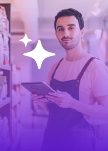 A person wearing an apron holds a tablet in a store aisle, with illustrated sparkles added to the image.