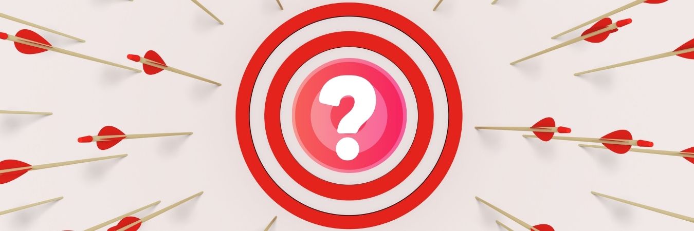 A target with a question mark in the center is surrounded by arrows, none of which hit the bullseye.