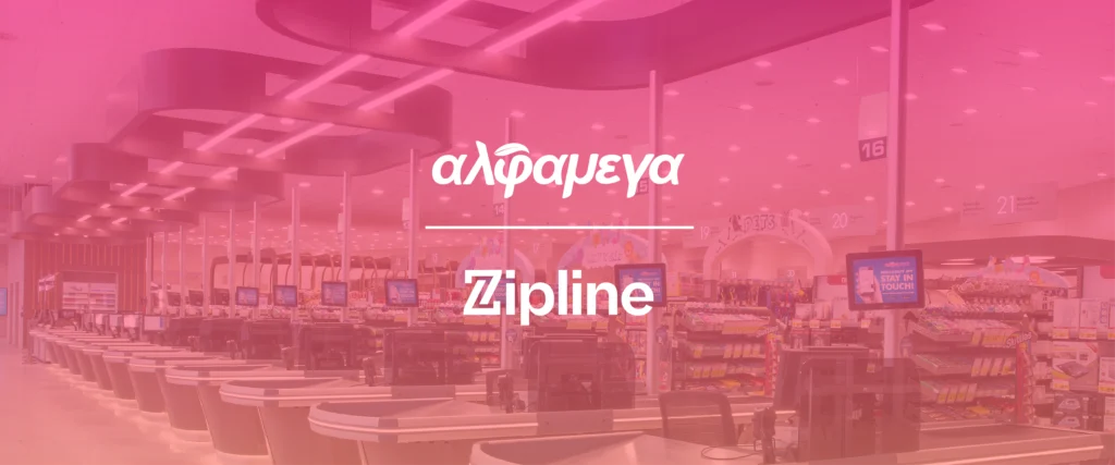 A grocery store checkout area with multiple registers, digital screens, and aisles; overlaid text reads "αλφαμεγα Zipline.