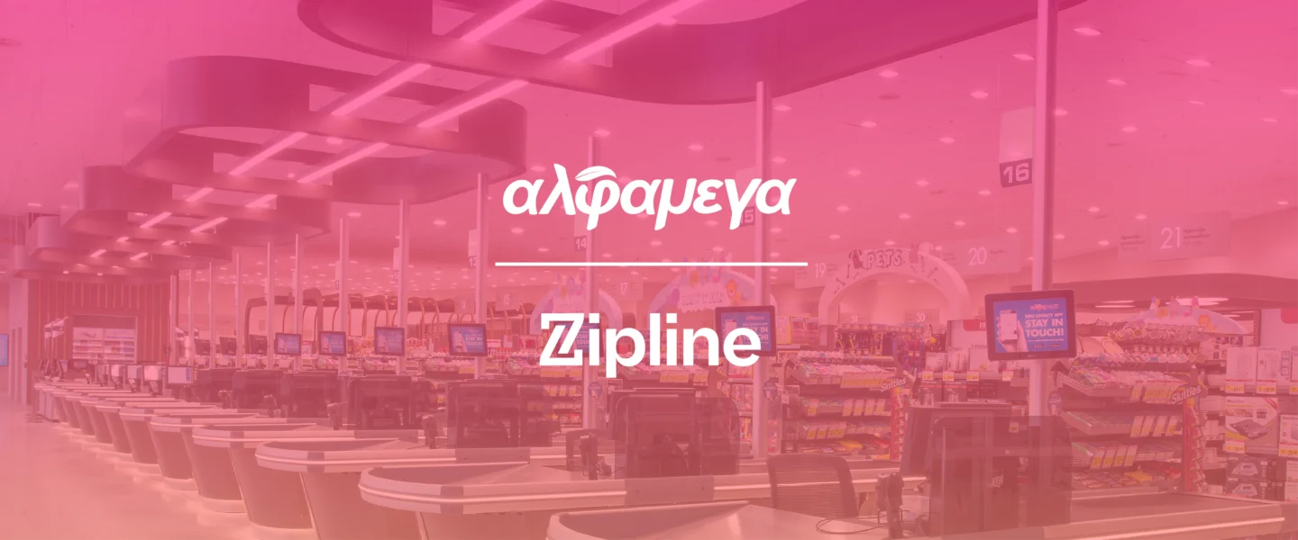 A grocery store checkout area with multiple registers, digital screens, and aisles; overlaid text reads "αλφαμεγα Zipline.