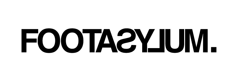 The image shows the word "FOOTASYLUM." in bold, black, uppercase letters, mirrored horizontally on a light background.